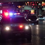 black car on road during night time