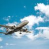 white airplane under blue sky during daytime