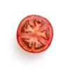 sliced tomato on white surface