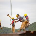 construction worker men holding hammer