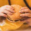 person holding hamburger