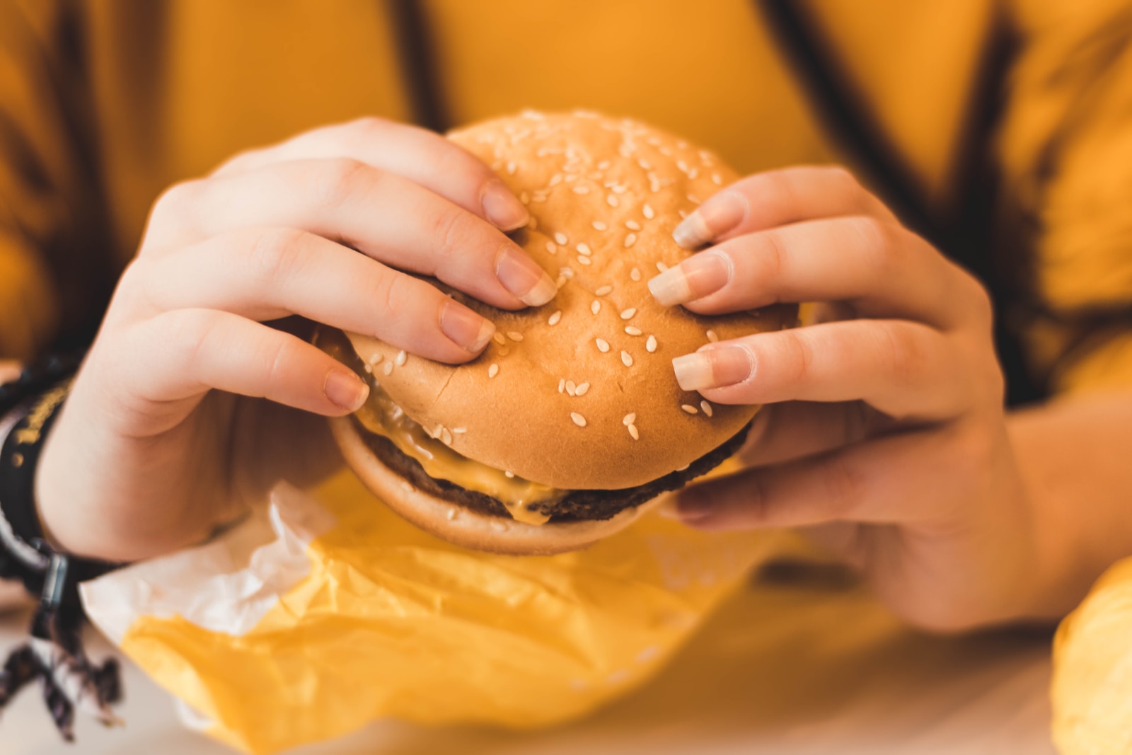 person holding hamburger