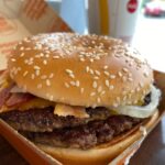 burger on brown wooden table